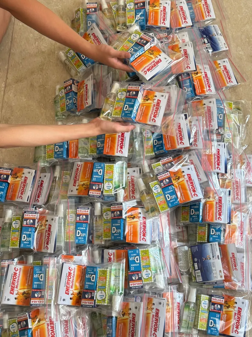 Rows of sealed care packs filled with vitamins and health essentials